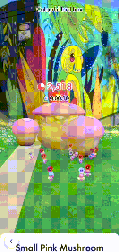 Winged Pikmin destroying part of a small pink mushroom.
