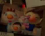 A picture of Olimar and his family on a bulletin board.