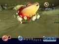 A dead Bulborb being carried off in an early version of Pikmin. Note how it is upside-down, unlike the final game, where it is simply slumped over.