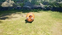 A Bomb Rock stuck between the eyestalks of a defeated Bulborb in Pikmin 4.