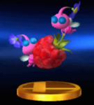 The trophy for Winged Pikmin in Super Smash Bros. for Nintendo 3DS and Wii U, showing 2 Pikmin around a Juicy Gaggle.