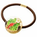 The Red Pikmin hair tie.
