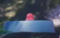 An unknown thimble-shaped saturated red object seen in the February 2023 trailer.