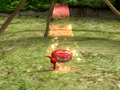 A Red Pikmin returning a red pellet to its Onion.