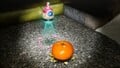 The treasure being carried by multiple Yellow Pikmin back to the S.S. Beagle.