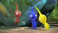 Two Pikmin laughing after staring at the distorted face of the Red Pikmin.