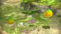 Two Yellow Wollyhops near Alph and some Winged Pikmin in an prerelease version of Pikmin 3.