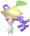 A White Special Decor Pikmin with Present Sticker (Gold) decor from Pikmin Bloom.