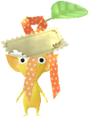 A Yellow Special Decor Pikmin with Present Sticker (Gold) decor from Pikmin Bloom.