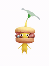 An animation of a Yellow Pikmin with a Macaron from Pikmin Bloom.