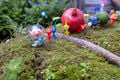Alph leading a group of Pikmin.