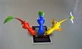 All 3 Pikmin join hands.