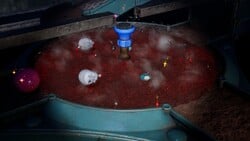 The sprinkler in Below-Grade Discotheque drowning several Pikmin in Pikmin 4.