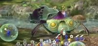 Some Pikmin fight a Peckish Aristocrab. A Blue Pikmin is trapped in a bubble.