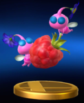 The trophy for Winged Pikmin in Super Smash Bros. for Nintendo 3DS and Wii U, showing 2 Pikmin around a Juicy Gaggle.