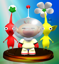 A trophy of Captain Olimar and two Pikmin.