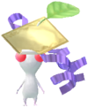 A White Decor Pikmin wearing a golden sticker from a Pikmin Bloom Tour.