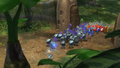 An early E3 2012 screenshot of Alph leading Pikmin; here his eyes are smaller.