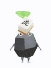 An animation of a rock Pikmin with a mahjong tile from Pikmin Bloom.