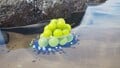 The treasure being carried by multiple Blue Pikmin.
