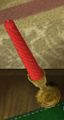 A red candle. A candle also appears as a treasure in Pikmin 2: it is called the Fleeting Art Form.