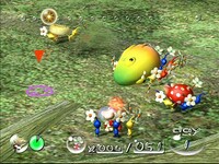 Pikmin returning deceased enemies and a yellow pellet to the Onions in a prerelease screenshot.