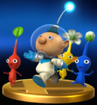 The trophy for Alph in the Wii U version of Super Smash Bros. for Nintendo 3DS and Wii U, being followed by a Red Pikmin, Yellow Pikmin, and Blue Pikmin.