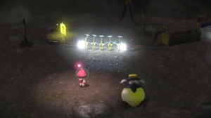 A screenshot from a cutscene introducing Yellow Pikmin in Pikmin 3, where the Pikmin complete an electric circuit.
