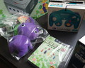 Bundle console's contents, including the console, controller, and Purple Pikmin plush.