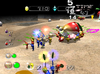 A group of Pikmin carrying a Bulbmin corpse in Green Hole.