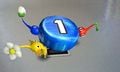 The 3 Pikmin are carrying a blue 1 pellet.
