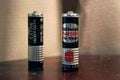 Two real National NEO Hi-Top AA batteries.