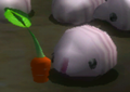 A Female Sheargrub next to a pikpik carrot in Pikmin 2's Piklopedia.