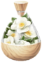 A jar full of white camellia petals.