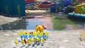 The character and their group of Pikmin approaching a puddle, alongside Oatchi.