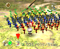 Olimar and a squad of Pikmin in the first game.