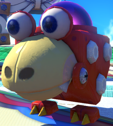 A Red Bulborb statue in the Nintendo Land plaza.