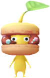 A yellow Decor Pikmin with the Sweetshop costume.