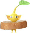 A Yellow Bakery Decor Pikmin with Baguette decor from Pikmin Bloom.