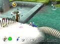 Wolpoles, Captain Olimar, Louie, and Blue Pikmin in an early version of the Perplexing Pool. The Shower Room can be seen ahead. Also note the Male Sheargrub, which never appears in the final version of the level.