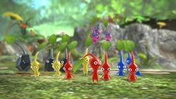 Rock Pikmin, Yellow Pikmin, Red Pikmin, Winged Pikmin, and Blue Pikmin sitting in the Garden of Hope. From https://youtu.be/WNuVrbUCeqM?t=191