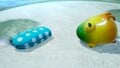 An alternative, more close-up, shot of the treasure in the location it is discovered, next to a defeated Masterhop.