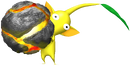A Yellow Pikmin holds a bomb rock.