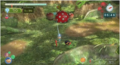 A Red Pikmin carrying a bomb rock in Pikmin 3.