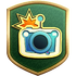 The "Shutterbug" badge in Pikmin 3 Deluxe.