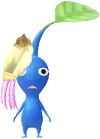 A Blue Special Decor Pikmin with Present Sticker (Gold) decor from Pikmin Bloom.