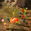 Pikmin follow Olimar and carry a red pellet during sunset.