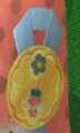 A ribbon with a Winged Pikmin found within the level.